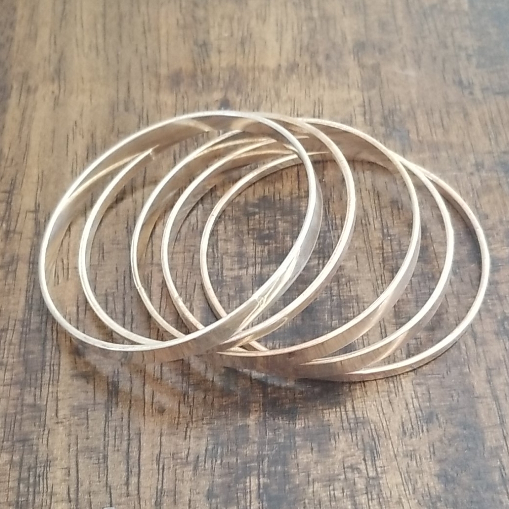 Set of 5 silver tone bangles